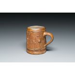 An unusual German stoneware mug depicting king Gambrinus, Cologne or Frechen, ca. 1600