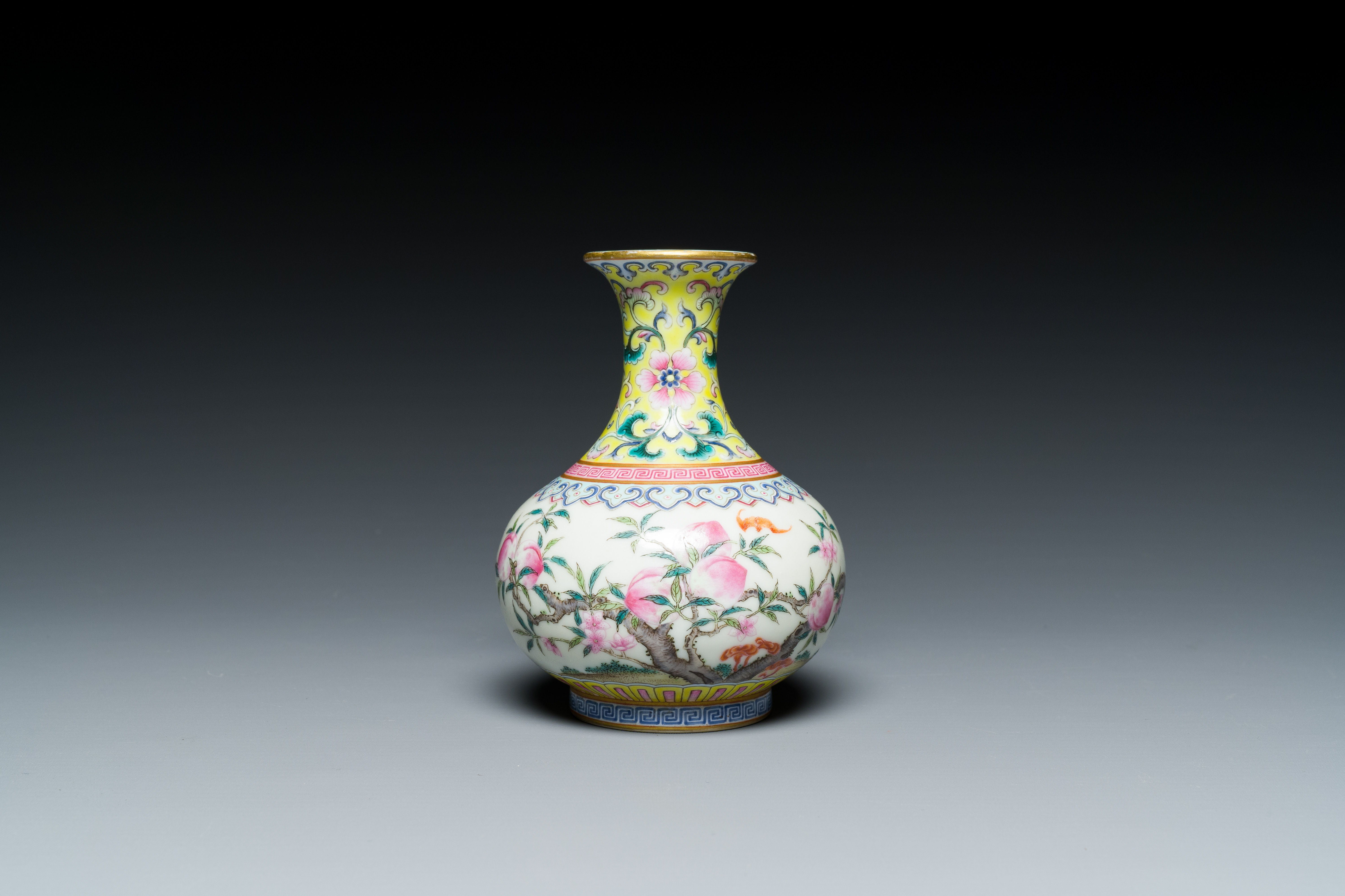 A small Chinese famille rose 'nine peaches' bottle vase, Jiaqing mark, 20th C. - Image 2 of 7