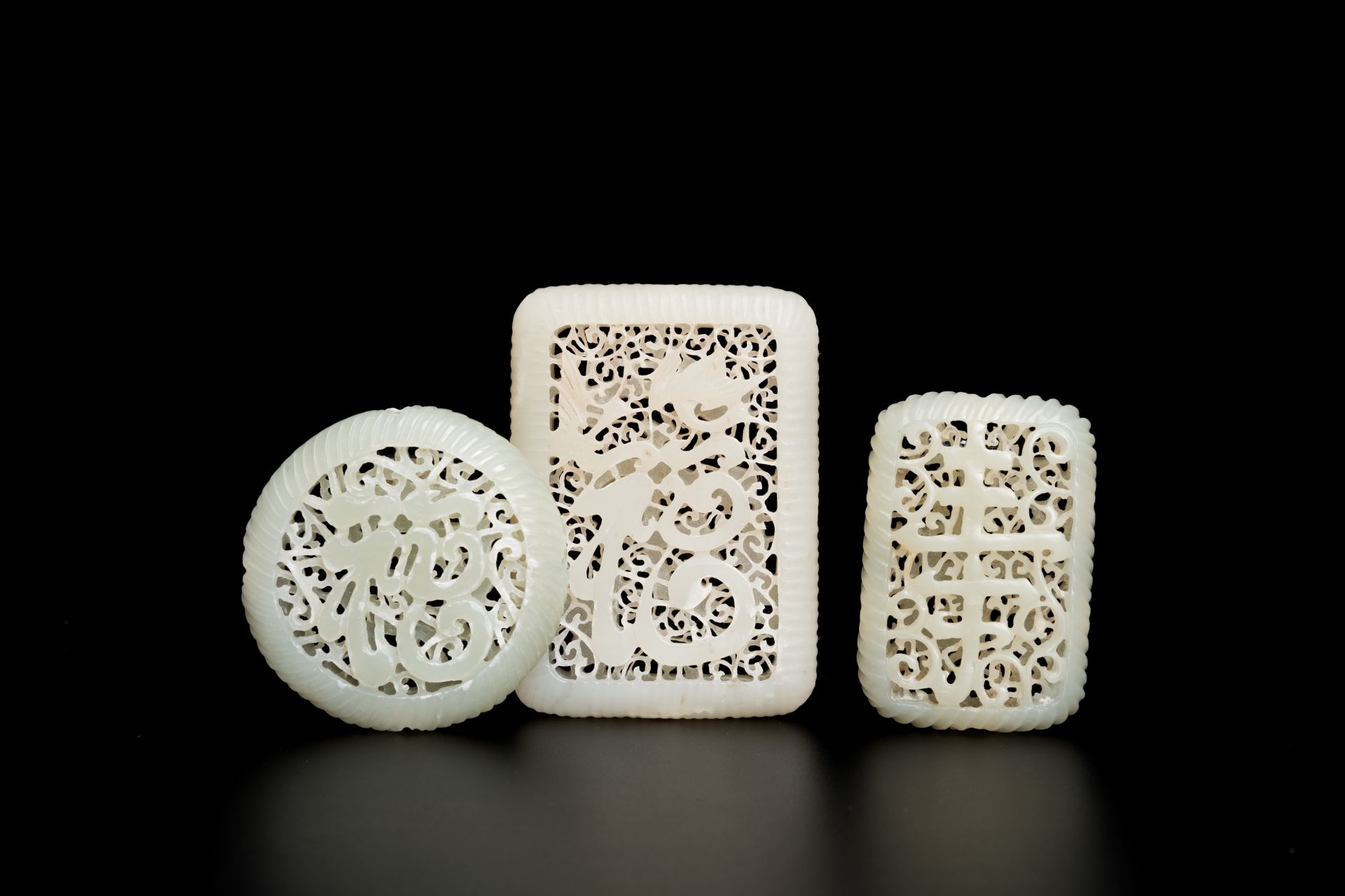 Three Chinese reticulated white jade carvings, Qing