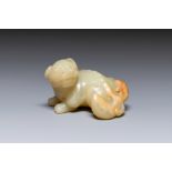 A Chinese white and russet jade sculpture of a mythical beast, 18th C.