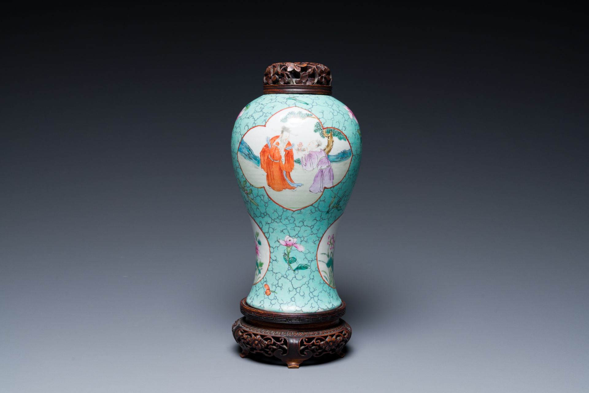 A Chinese turquoise-ground famille rose vase with reticulated wooden cover and stand, 1st half 19th