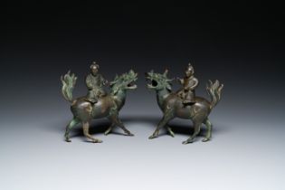 A pair of Chinese bronze 'boy on kylin' censers, Ming