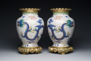 A pair of Chinese white-ground cloisonne 'dragon' vases with gilt bronze mounts, 19th C.