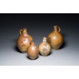 Four stoneware bellarmine jugs with various seals, Frechen and Cologne, Germany, early 17th C.