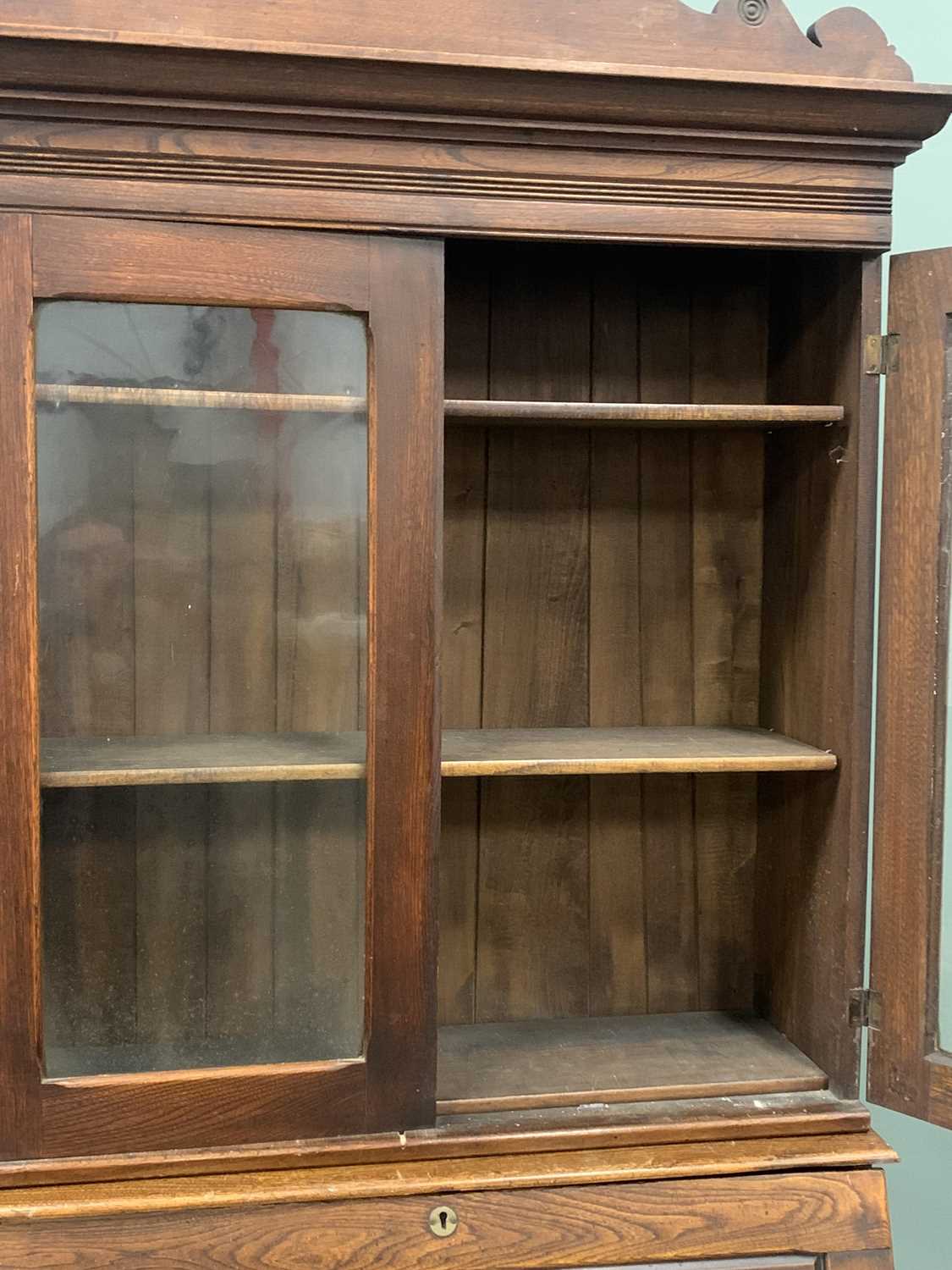 VINTAGE OAK BUREAU BOOKCASE - having twin glazed doors under a decorative crest rail over a drop - Image 5 of 6