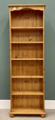 MODERN PINE OPEN BOOKCASE - having six shelves, on turned bun feet, 183cms H, 61cms W, 26cms D
