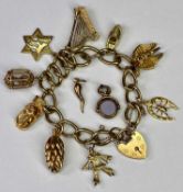 9CT GOLD CHARM BRACELET - with padlock clasp holding 9 quality charms in 10ct x 1, 14ct x 4 and 18ct