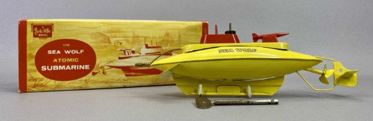 A SUTCLIFFE MODELS TIN PLATE CLOCKWORK SEAWOLF ATOMIC SUBMARINE - yellow body, red plastic