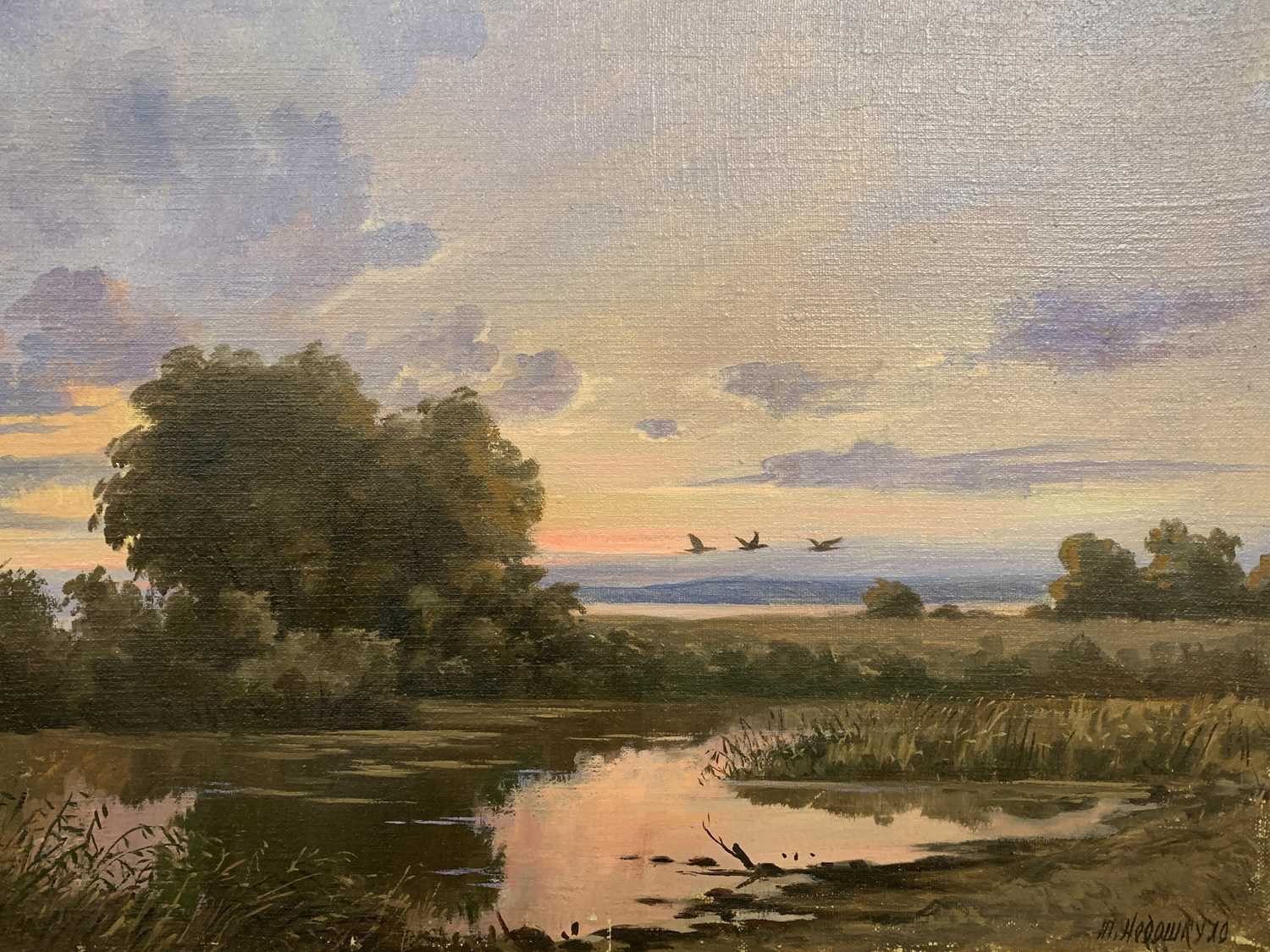 OIL ON CANVAS early 20th century - birds flying above marshland, indistinctly signed lower right,