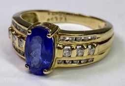 18CT GOLD TANZANITE & DIAMOND RING - 1.99ct claw set oval central stone, 10 x 6mm, with three inline