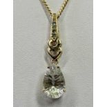 9CT GOLD PEAR DROP FACET CUT CRYSTAL SET NECKLACE - stamped '9-375' the pear drop pendant claw set