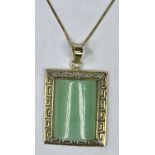 CONTINENTAL 9CT GOLD & JADE PENDANT - on fine link 9ct gold necklace, 26.5cms overall L, 23 x 20mm