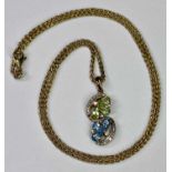 9CT GOLD PENDANT NECKLACE - with twist floral diamond and other gem set drop on a triple trace 9ct