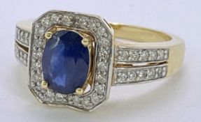18CT GOLD BLUE SAPPHIRE & DIAMOND RING - approx 1ct oval facet cut sapphire, 8 x 6mm, claw set in