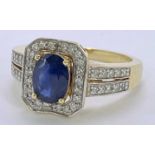 18CT GOLD BLUE SAPPHIRE & DIAMOND RING - approx 1ct oval facet cut sapphire, 8 x 6mm, claw set in