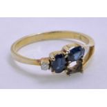 14CT GOLD BLUE SAPPHIRE & DIAMOND DRESS RING - having split shoulder detail to one side, lacking one