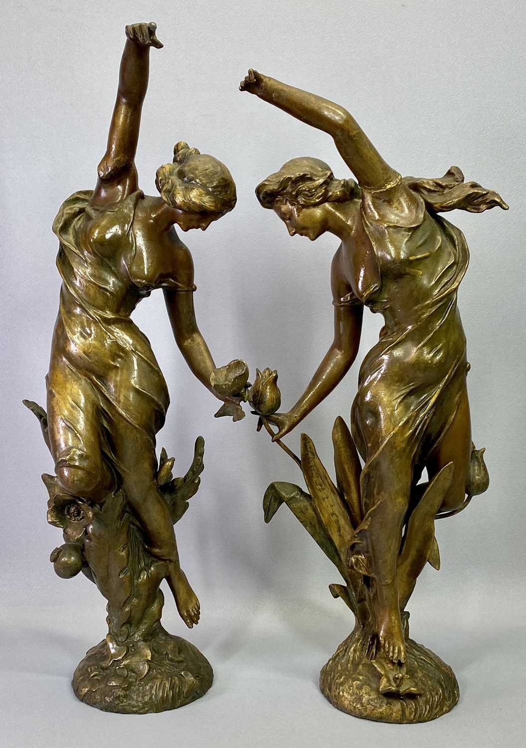 FRENCH ART NOUVEAU PAINTED SPELTER FIGURES, A PAIR - dancing flower girls, 60cms H