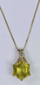 9CT GOLD PENDANT NECKLACE - the open pendant set with a large, believed, yellow facet cut citrine