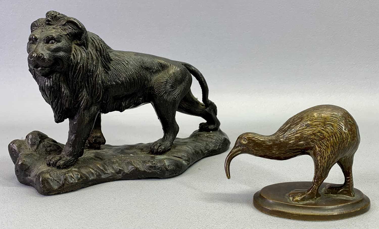 AFTER BARRIE CAST BRONZE FIGURE OF A LION, 15cms H and a cast bronze figure of a Rotorua Kiwi