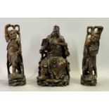 CHINESE CARVED HARDWOOD FIGURE OF A SEATED EMPEROR READING & HOLDING HIS BEARD, 32cms H and two