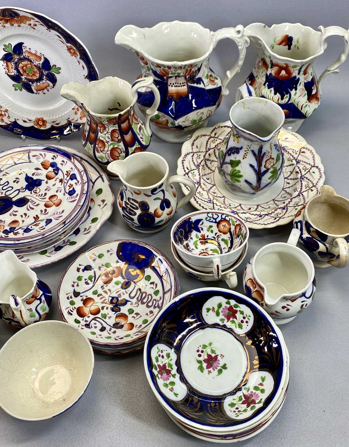 GAUDY WELSH LATE 19TH CENTURY POTTERY - a large selection including a pair of panelled jugs, 18.5cms - Image 3 of 4