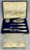 SILVER MOUNTED MANICURE SET and an Art Deco silver cigarette box, Birmingham hallmarks 1917 and