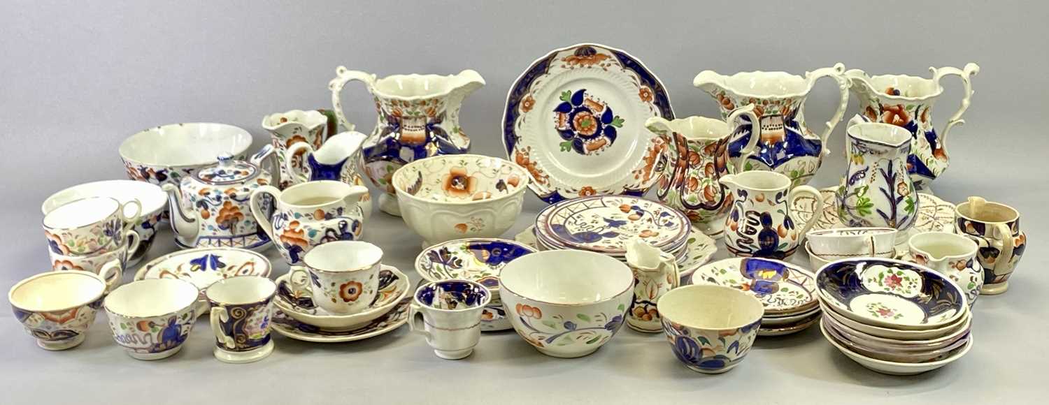 GAUDY WELSH LATE 19TH CENTURY POTTERY - a large selection including a pair of panelled jugs, 18.5cms