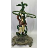 PAINTED CAST IRON STICK/UMBRELLA STAND - modelled with a man amongst entwined foliage upon a