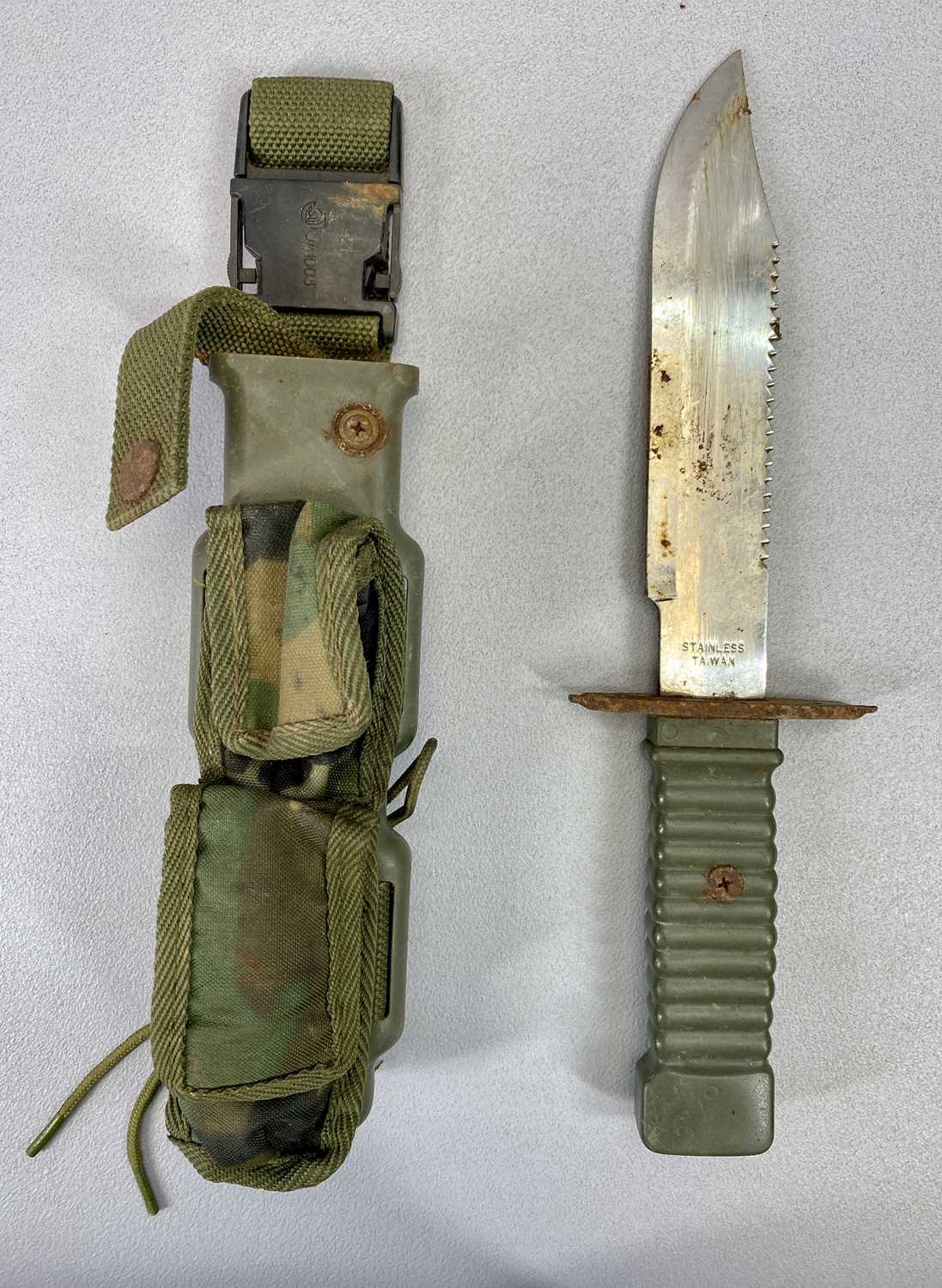 A GAS MASK IN CLOTH BAG, a sheath knife with 19cms blade and a wall plaque, Saigon Flyer, D McNiff - Image 2 of 3
