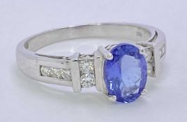 18CT WHITE GOLD & POSSIBLY BLUE TANZANITE & DIAMOND RING - approx 1ct oval facet cut central