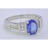 18CT WHITE GOLD & POSSIBLY BLUE TANZANITE & DIAMOND RING - approx 1ct oval facet cut central
