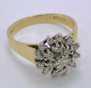 18CT GOLD STAR CLUSTER DIAMOND RING - coronet openwork mount against raised shoulders, Size mid O-P,