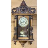 WALNUT CASED VIENNA WALL CLOCK - cream enamel dial with black Roman numerals and gilded brass bezel,