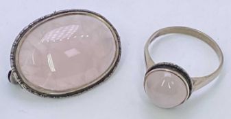 OVAL SILVER FRAMED BROOCH with large cabochon pink milky citrine, 6.4grms gross, and a similar