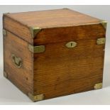 AN OAK BRASS BOUND TRAVELLING BOTTLE CHEST - with folding brass side handle, the hinged cover
