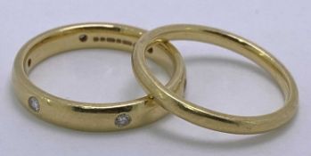 18CT GOLD WEDDING BANDS (2) - to include a plain example, Size mid Q-R, and a wider band example