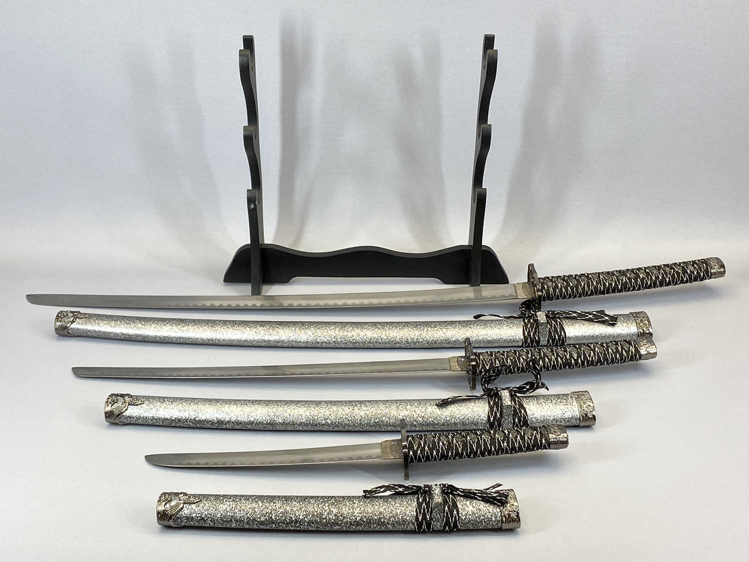 GRADUATED SET OF 3 MODERN DECORATIVE JAPANESE STYLE SAMURAI SWORDS - 101cms L - 54cms L, with