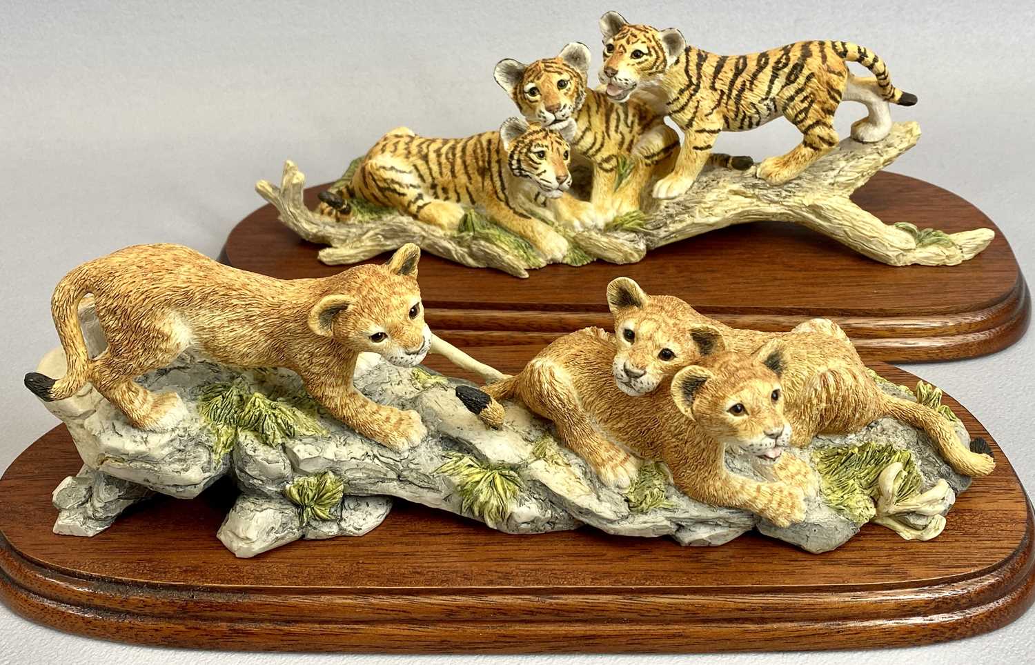 BORDER FINE ARTS FIGURES (2) - Tiger Cubs, RW62, on wooden stand, 10cms H and Lion Cubs, RW61, on