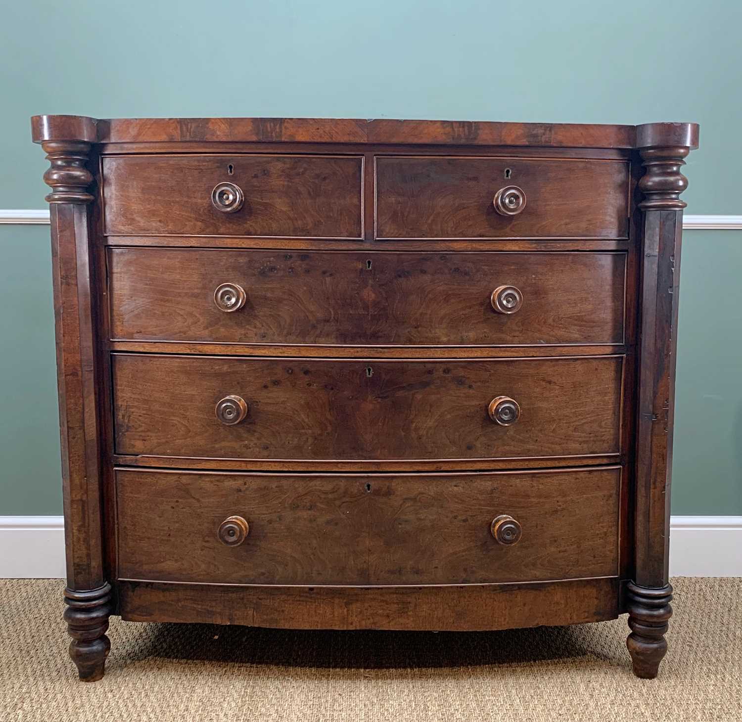 LATE VICTORIAN MAHOGANY BOW-FRONT CHEST, with out-set octagonal section column corners, fitted two