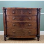 LATE VICTORIAN MAHOGANY BOW-FRONT CHEST, with out-set octagonal section column corners, fitted two