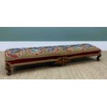 VICTORIAN WALNUT & BEADED WOOLWORK LONG STOOL, angled, with carved central barcket, short cabriole