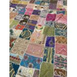 INDIAN EMROIDERED BEDSPREAD HANGING, composed of patchwork pieces from highly decorated saris