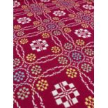 TRADITIONAL WELSH WOOLEN BLANKET with classical blanket stitch to two seams, geometric design in red