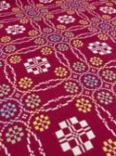 TRADITIONAL WELSH WOOLEN BLANKET with classical blanket stitch to two seams, geometric design in red