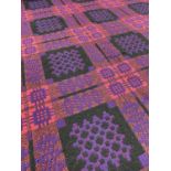 TRADITIONAL WELSH TAPESTRY BLANKET, of geometric reversible design, pink ground with purple and