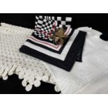 ASSORTED TEXTILES, comprising a white calico yoyo table cover, crochet table cover, black and