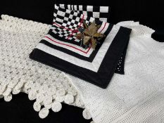 ASSORTED TEXTILES, comprising a white calico yoyo table cover, crochet table cover, black and