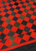 VINTAGE WELSH RED & BLACK WOOLEN PATCHWORK QUILT, central 'chequer board' panel within black