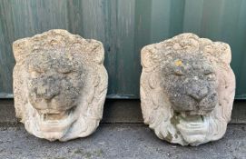 GARDEN ORNAMENTS: comprising pair composition stone lion masks, 47cm h (2)