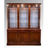MODERN GEORGIAN STYLE MAHOGANY CABINET, with adjustable glass shelves, on a cupboard base, with a